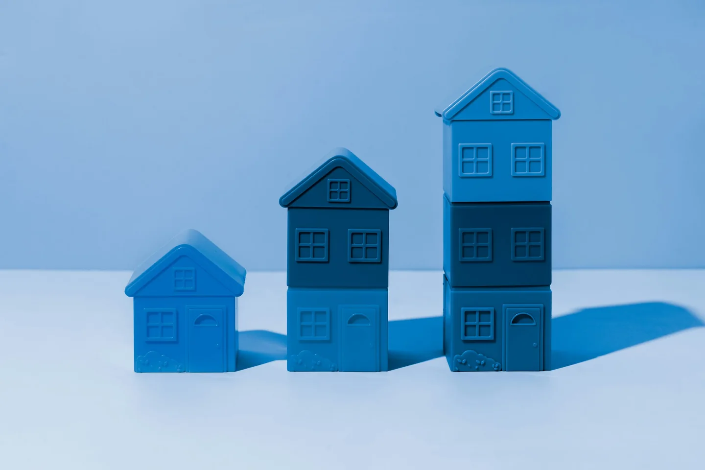 Blue model houses increasing in height
