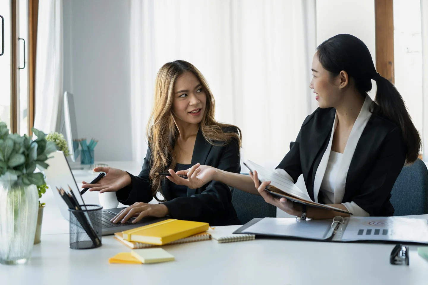Two property professionals in a mentoring meeting