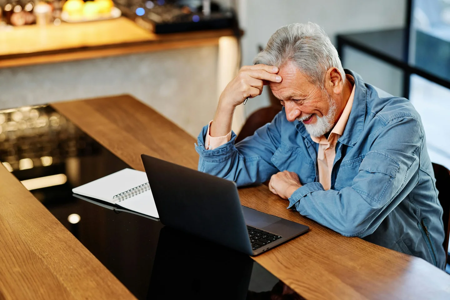 Professional completing online learning at a laptop