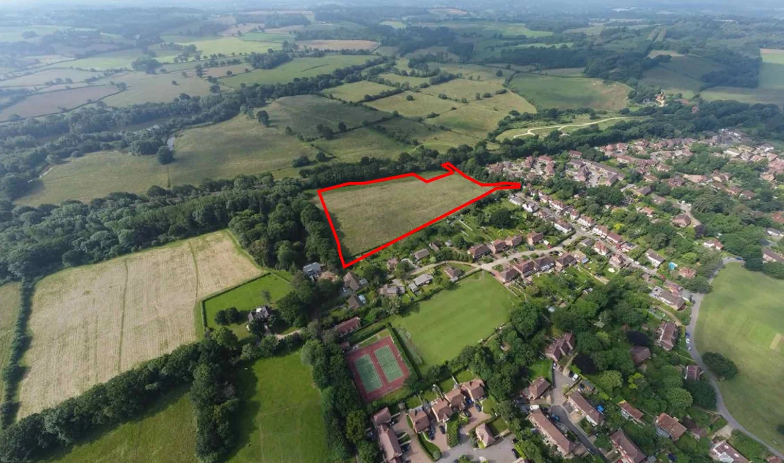 Aerial view of a potential development site outlined in red